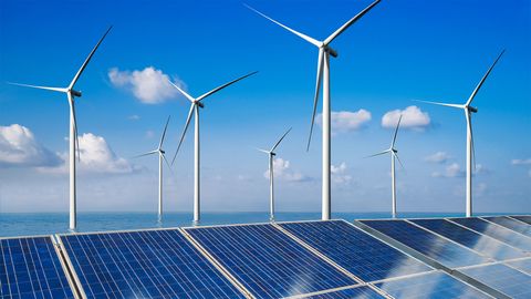 Solar energy panels and wind turbines at sea